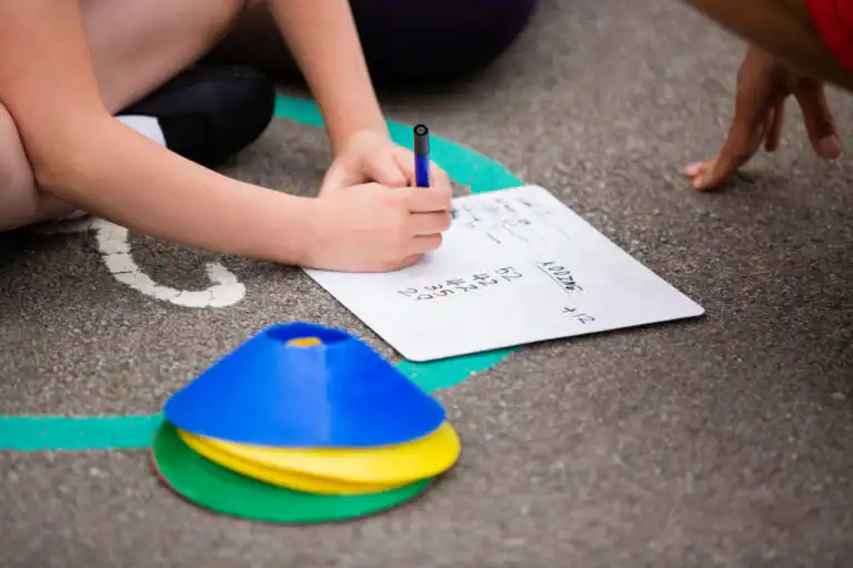 Children writing on Whiteboard