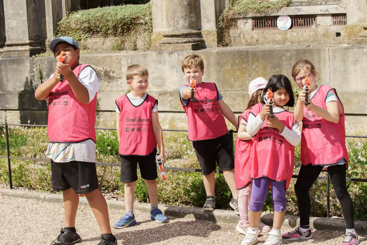 Group of children on Time4Sport summer camp with water guns