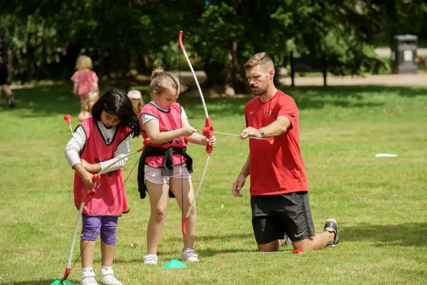 children taking archery lession with time4sport educator